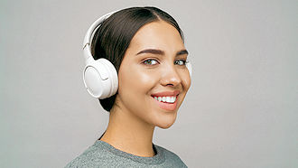Woman with headphones listening to audio